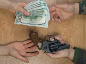 gun and money exchange 