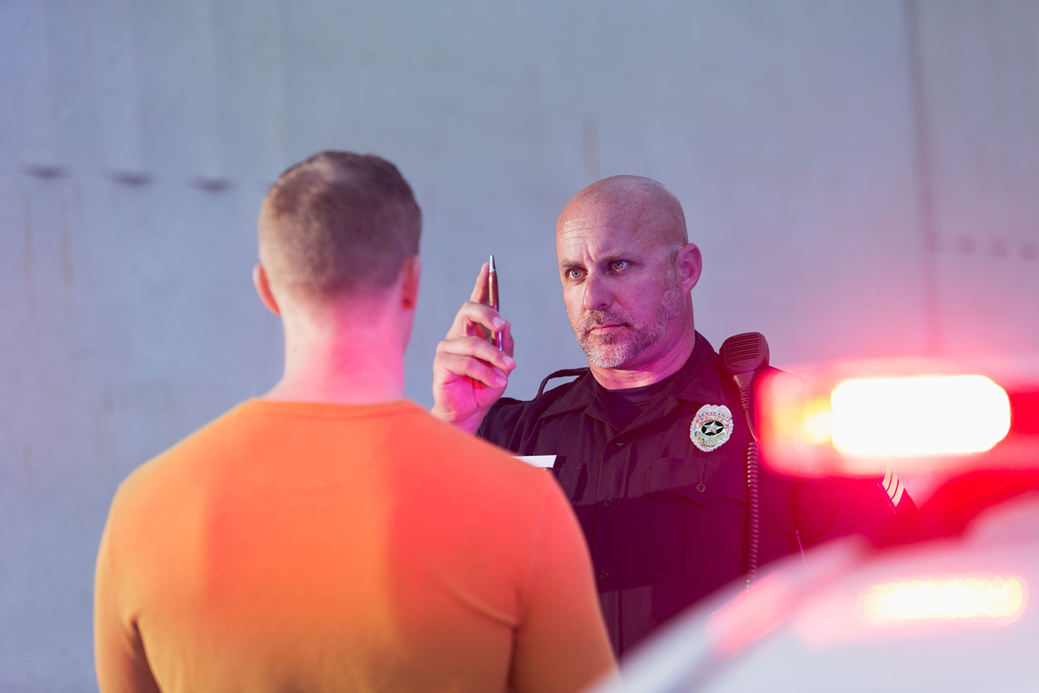 Do I Need an Attorney for DWI? Law enforcement and stopped individual.
