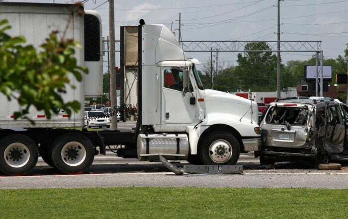most common causes for semi truck accidents in minnesota, semi truck rear ends a passenger auto on a local road